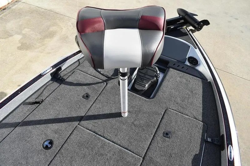 Slide: The Image of 2026 Triton 179 TrX boat deck with cushioned seat and storage compartments. - 34
