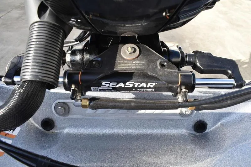 Slide: The Image of Close-up of SeaStar hydraulic steering system on 2026 Triton 179 TrX boat. - 38