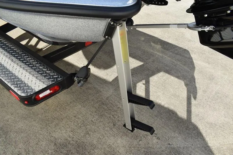 Slide: The Image of 2026 Triton 179 TrX boat trailer with step ladder and diamond plate detail. - 4