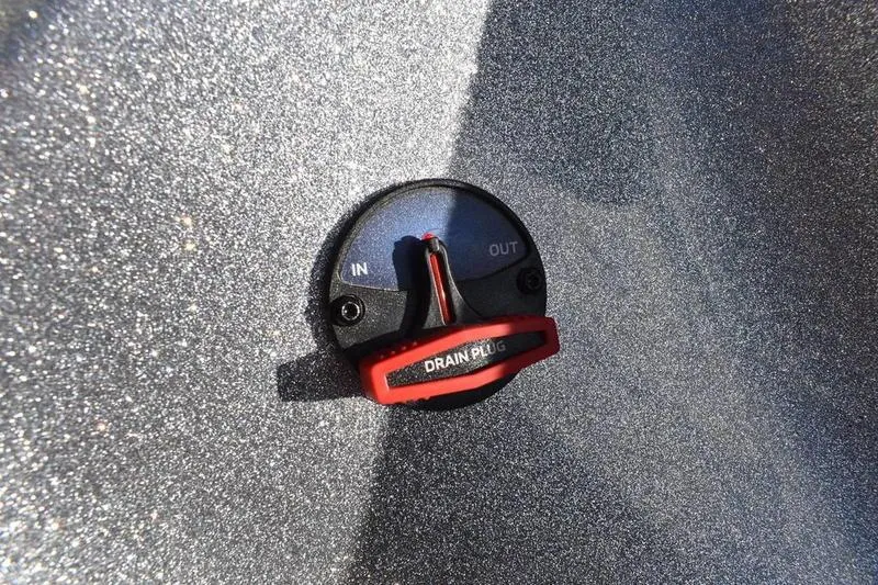 Slide: The Image of Drain plug on 2026 Triton 179 TrX boat, labeled "IN" and "OUT." - 41