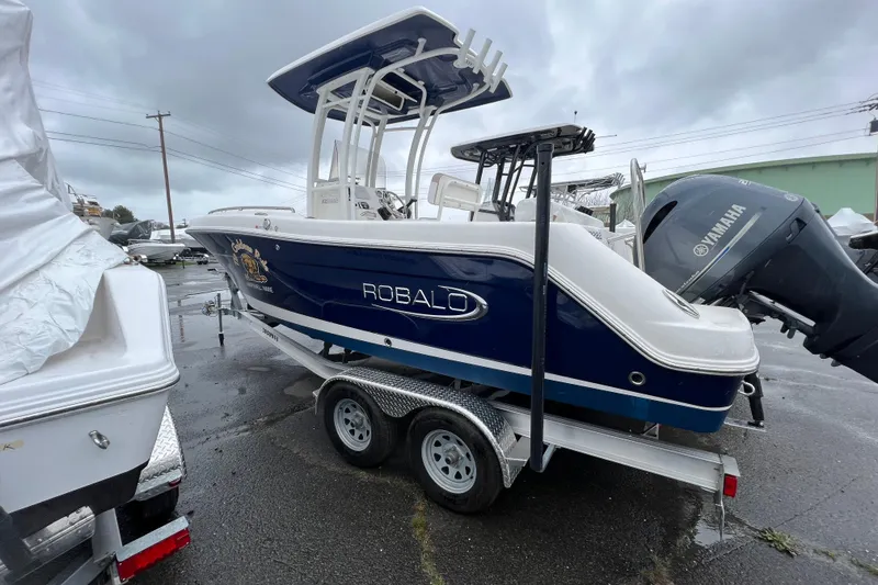 The Image of 2021 Robalo R222 Center Console boat on trailer, featuring Yamaha outboard motor. - 0