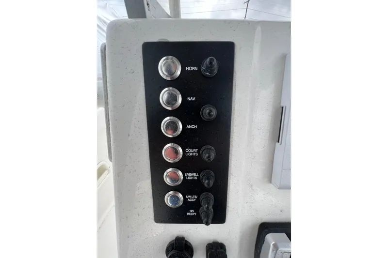 Slide: The Image of Control panel of 2021 Robalo R222 Center Console boat with labeled switches. - 3
