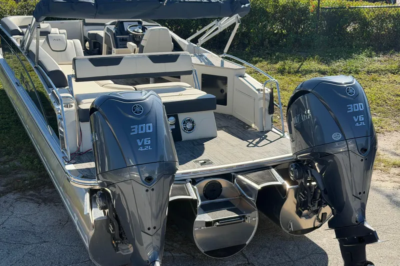 Slide: The Image of 2026 Avalon Catalina boat with dual Yamaha 300 V6 engines, sleek design, and spacious seating. - 2