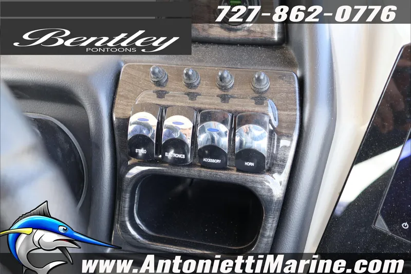 Slide: The Image of Control panel of 2026 Bentley Pontoons Elite 253 Admiral with switches and branding. - 15