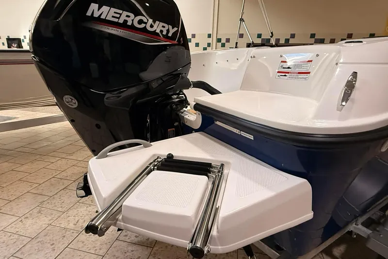 Slide: The Image of 2025 Bayliner Element E16 with Mercury outboard motor and swim platform. - 5