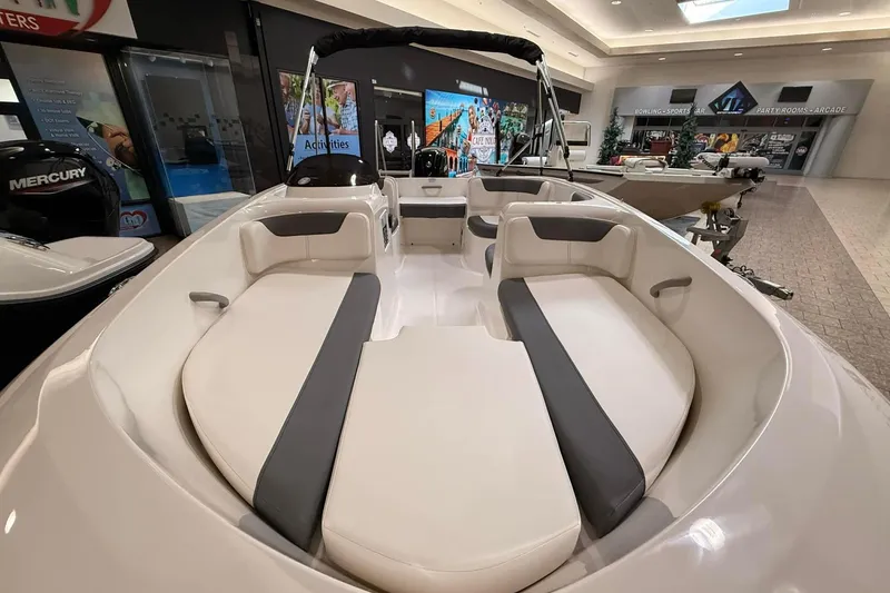 Slide: The Image of 2025 Bayliner Element E16 boat interior with spacious seating and modern design. - 4