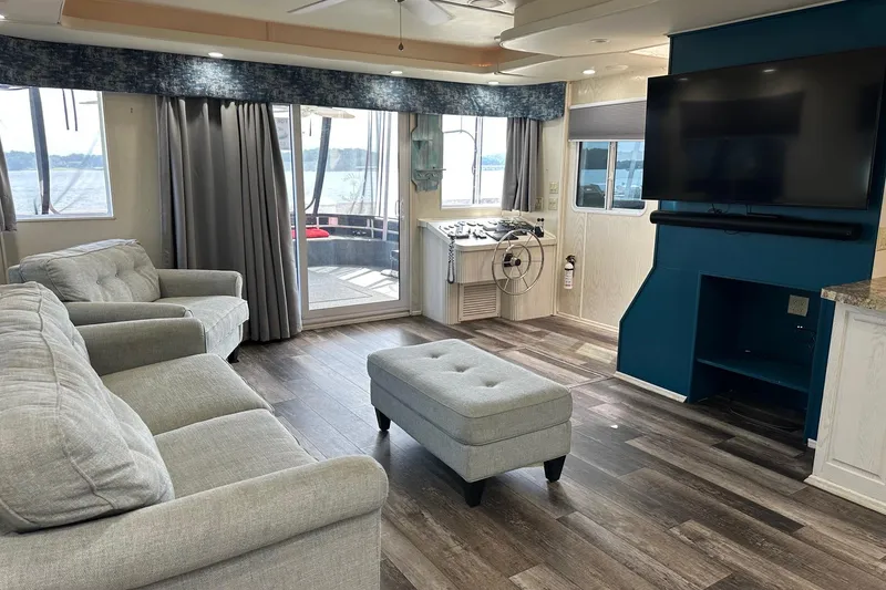 Slide: The Image of Luxurious 2000 Sharpe 16x90 houseboat interior with modern living area, large TV, and lake view. - 3