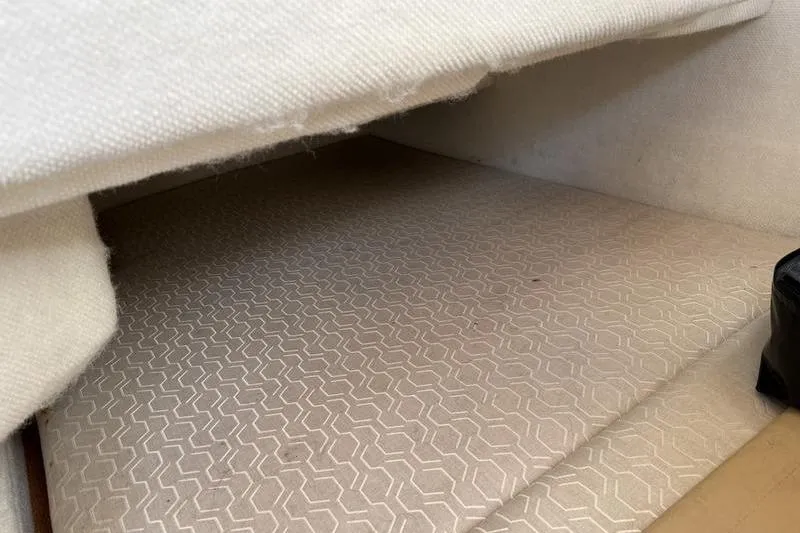 Slide: The Image of Interior cabin space of 2021 Ranger Tugs R-27 with patterned upholstery. - 13