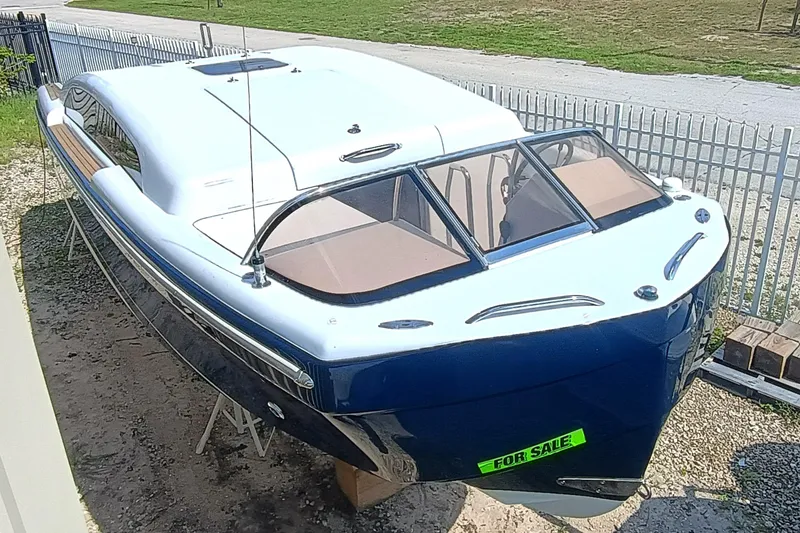 The Image of 2006 Royal Denship Royal Limo boat for sale, blue and white exterior, parked outdoors. - 0