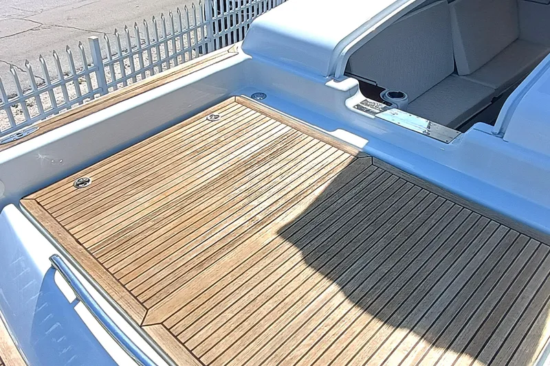 Slide: The Image of 2006 Royal Denship Royal Limo boat with teak deck and seating area. - 10