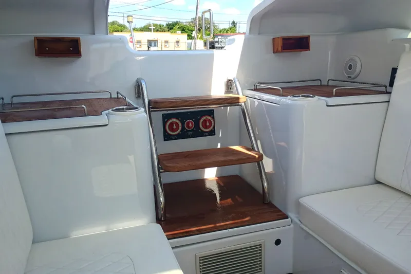 Slide: The Image of Interior of 2006 Royal Denship Royal Limo yacht with wooden steps and seating. - 13