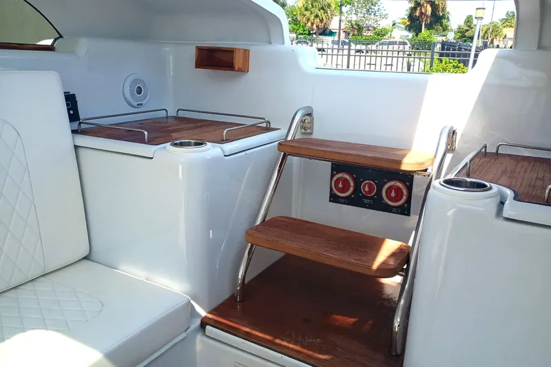 Slide: The Image of Interior of 2006 Royal Denship Royal Limo yacht with wooden steps and seating. - 14
