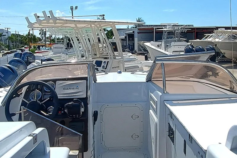 Slide: The Image of 2006 Royal Denship Royal Limo boat with Garmin navigation, docked among other vessels. - 17