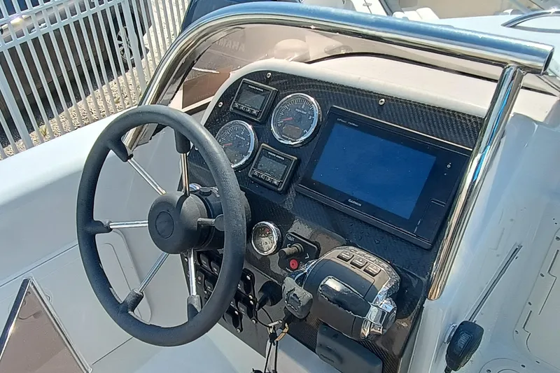 Slide: The Image of Steering console of a 2006 Royal Denship Royal Limo boat with gauges and controls. - 20