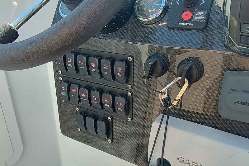 Slide: The Image of Control panel of a 2006 Royal Denship Royal Limo yacht with switches and keys. - 23