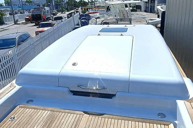 Slide: The Image of 2006 Royal Denship Royal Limo yacht deck with sleek design and wooden accents. - 8