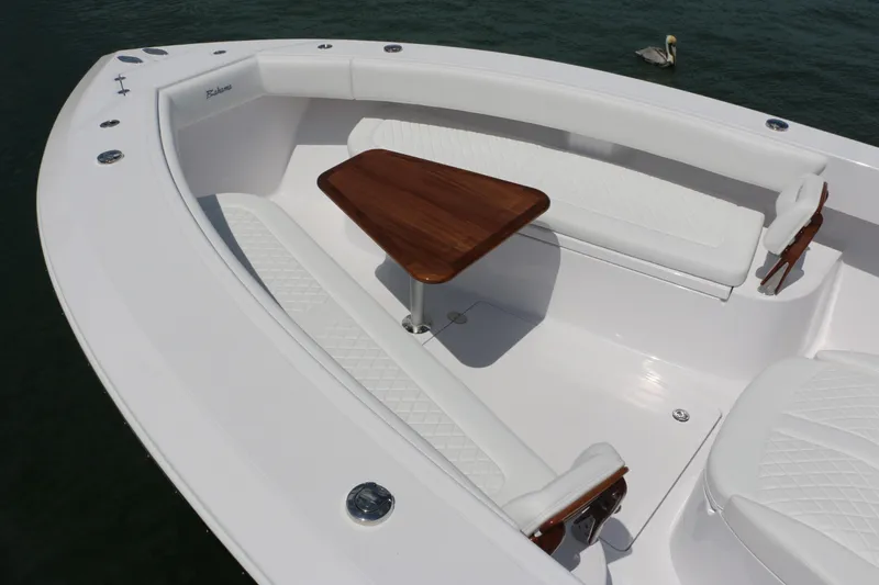 Slide: The Image of Luxurious seating area on 2026 Bahama 41 GT boat with wooden table. - 11