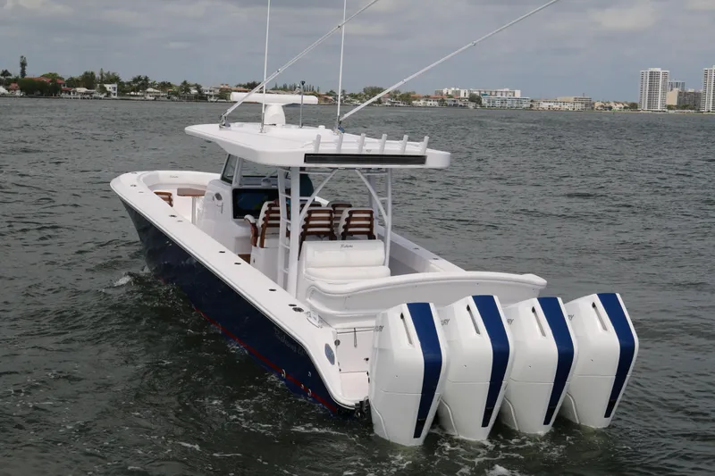 Slide: The Image of 2026 Bahama 41 GT boat with four powerful engines cruising on the water. - 16