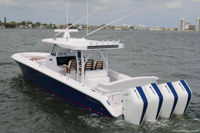 Slide: The Image of 2026 Bahama 41 GT boat with quad engines cruising on open water. - 18