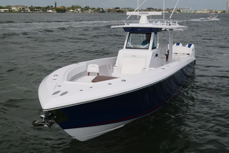 Slide: The Image of 2026 Bahama 41 GT boat on water, featuring sleek design and advanced navigation system. - 35