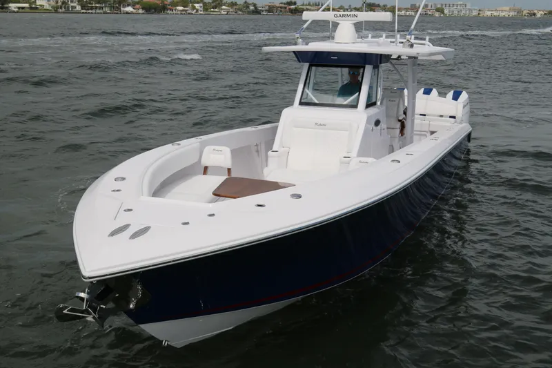 Slide: The Image of 2026 Bahama 41 GT boat cruising on open water, featuring sleek design and modern amenities. - 36