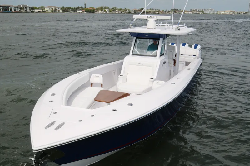 Slide: The Image of 2026 Bahama 41 GT boat cruising on open water, featuring sleek design and modern amenities. - 37