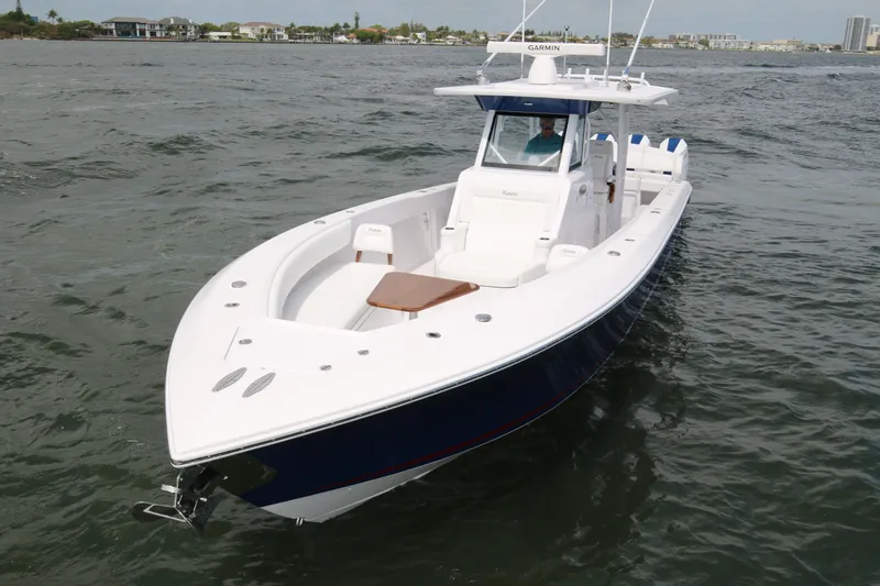 Slide: The Image of 2026 Bahama 41 GT boat cruising on open water, showcasing sleek design and modern features. - 38