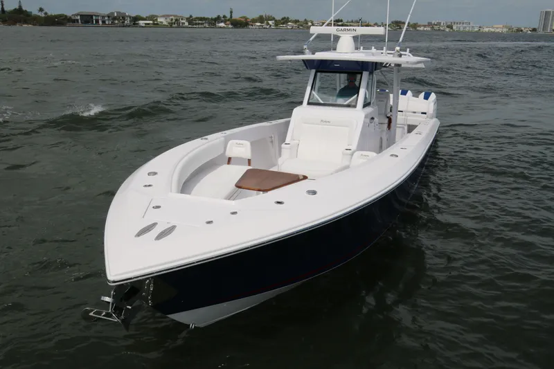 Slide: The Image of 2026 Bahama 41 GT boat cruising on open water, showcasing sleek design and modern features. - 39