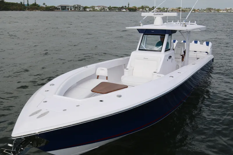 Slide: The Image of 2026 Bahama 41 GT boat on water, featuring sleek design and modern amenities. - 44