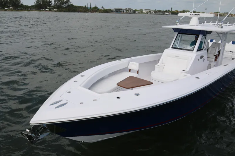 Slide: The Image of 2026 Bahama 41 GT boat on water, featuring sleek design and modern amenities. - 45