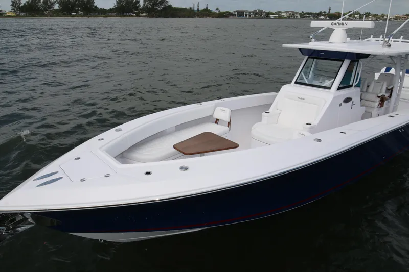 Slide: The Image of 2026 Bahama 41 GT boat on water, featuring sleek design and spacious deck. - 47