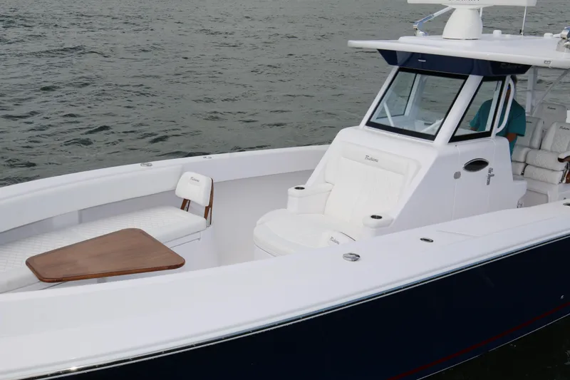 Slide: The Image of 2026 Bahama 41 GT boat with sleek design and luxurious seating on water. - 49