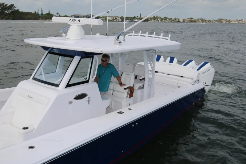 Slide: The Image of 2026 Bahama 41 GT boat cruising on water, featuring sleek design and modern technology. - 51