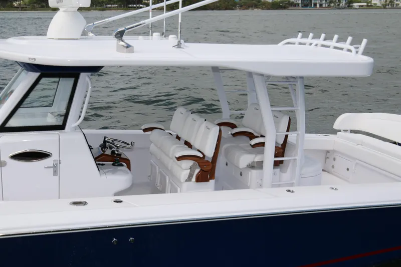 Slide: The Image of 2026 Bahama 41 GT boat with sleek design and luxurious seating on the water. - 56