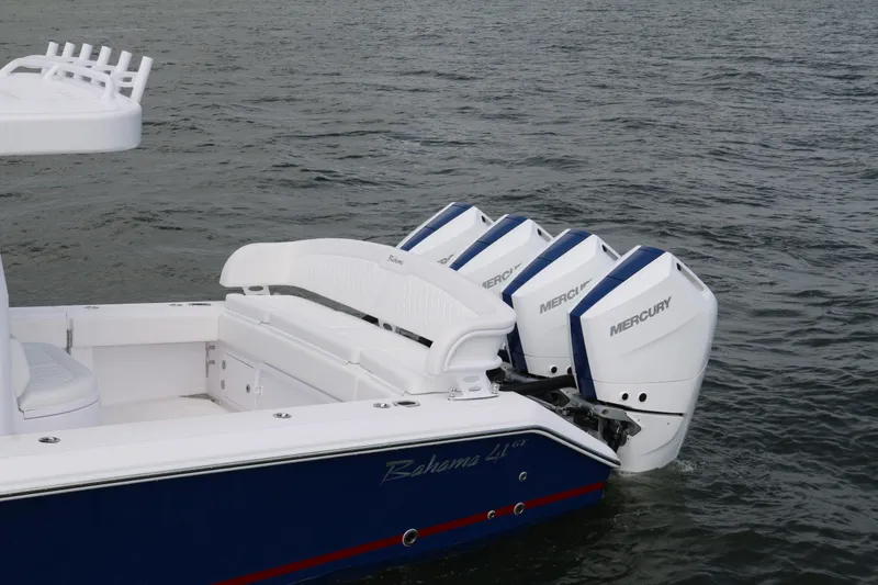 Slide: The Image of 2026 Bahama 41 GT boat with triple Mercury outboard engines on water. - 63