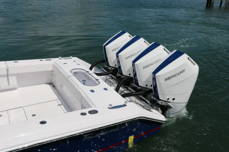Slide: The Image of 2026 Bahama 41 GT boat with four Mercury outboard engines on water. - 7