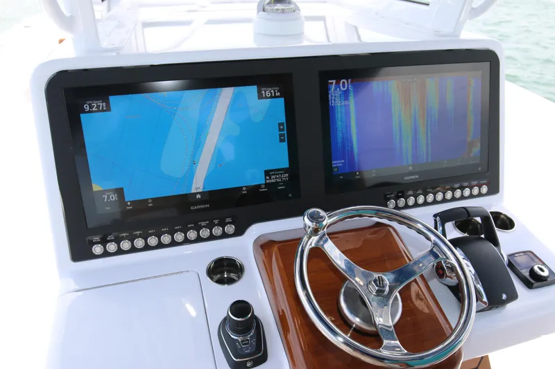 Slide: The Image of Control panel of 2026 Bahama 41 GT boat with dual Garmin displays. - 72