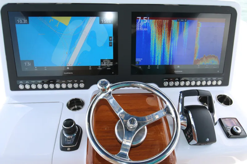 Slide: The Image of Steering console of 2026 Bahama 41 GT with dual Garmin displays and controls. - 75