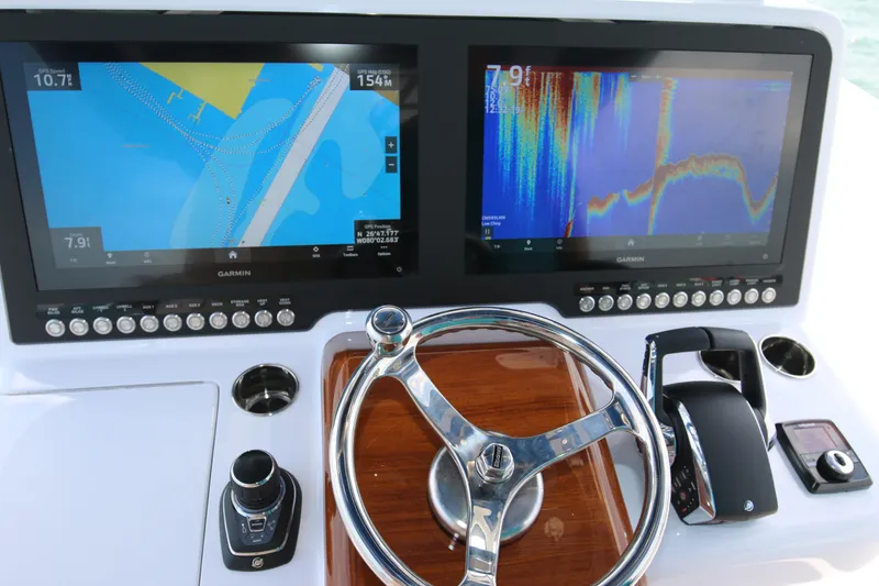 Slide: The Image of Helm of 2026 Bahama 41 GT with dual Garmin displays and steering wheel. - 77