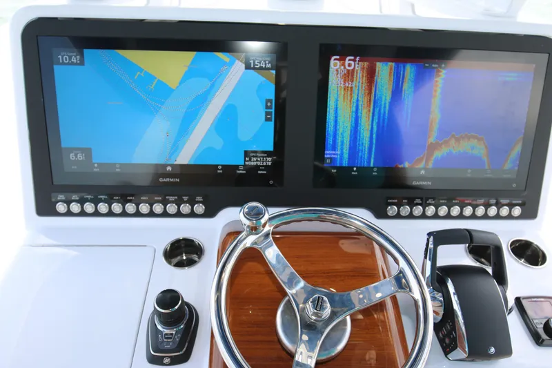 Slide: The Image of Dashboard of 2026 Bahama 41 GT boat with dual Garmin navigation screens. - 78