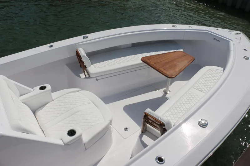 Slide: The Image of Luxurious seating area on 2026 Bahama 41 GT boat with elegant wood table. - 85
