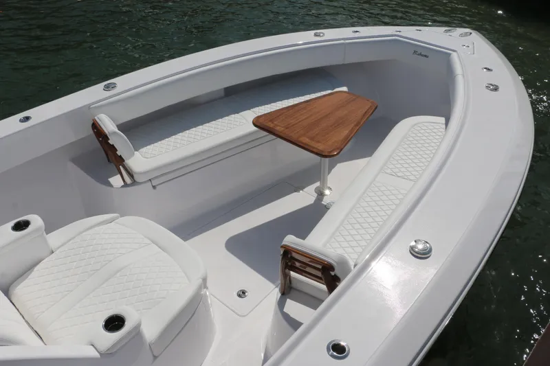 Slide: The Image of Luxurious seating area on 2026 Bahama 41 GT boat with elegant wood table. - 87