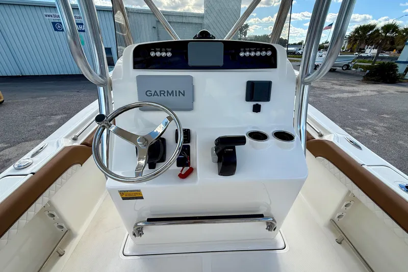 Slide: The Image of 2024 Pioneer 222 Islander boat console with Garmin navigation and Yamaha controls. - 5