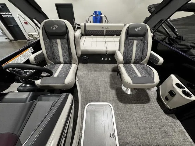Slide: The Image of 2025 Barletta Boats R23UCA interior with plush seating and modern design. - 6