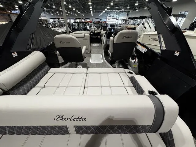 Slide: The Image of 2025 Barletta R23UCA boat interior with luxurious seating and modern design. - 8