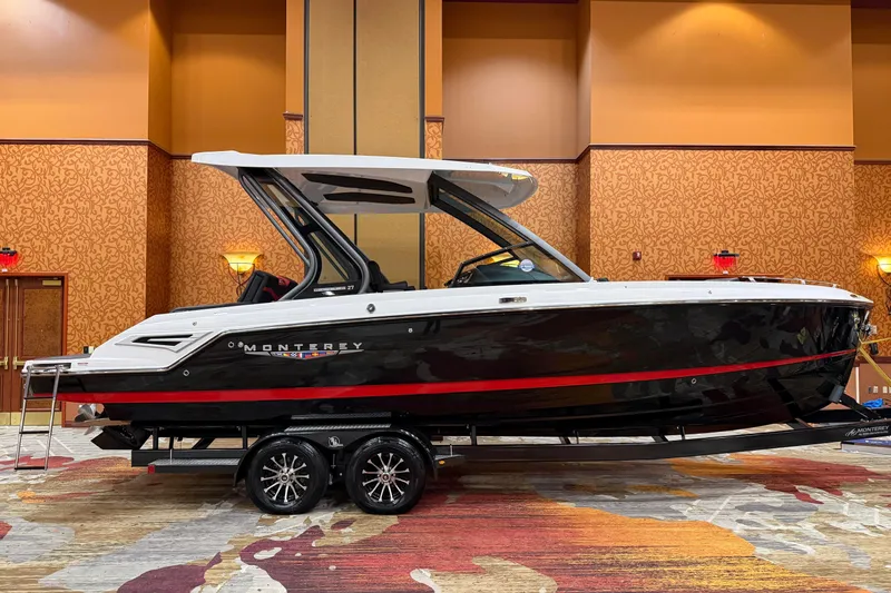The Image of 2026 Monterey Elite 27 SD boat displayed indoors on a trailer. - 0