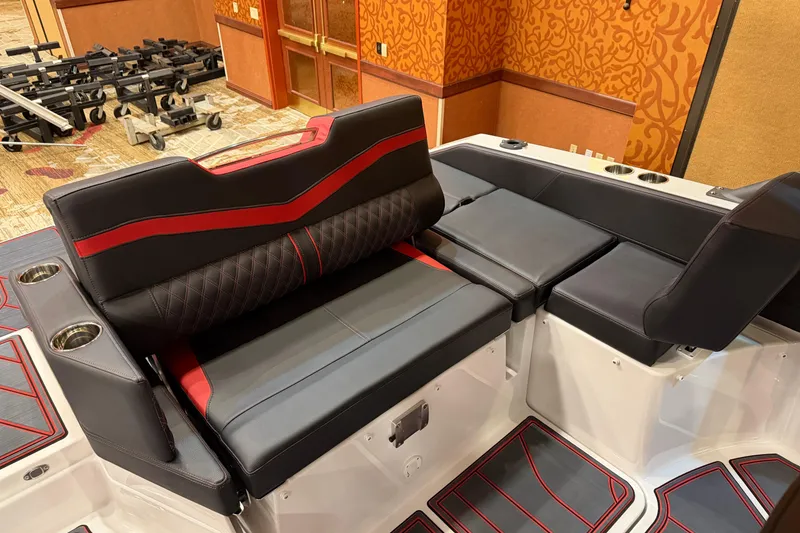 Slide: The Image of 2026 Monterey Elite 27 SD boat interior with stylish black and red seating. - 3