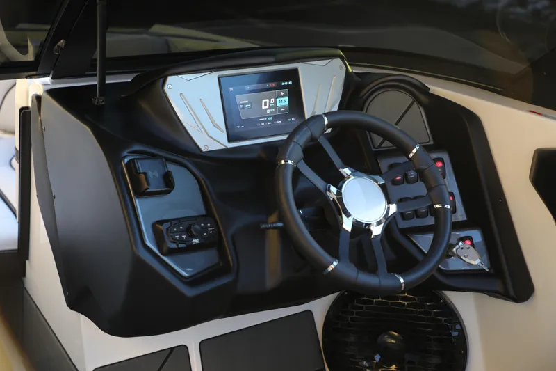 Slide: The Image of 2026 Supreme S220 boat dashboard with modern steering wheel and digital display. - 12