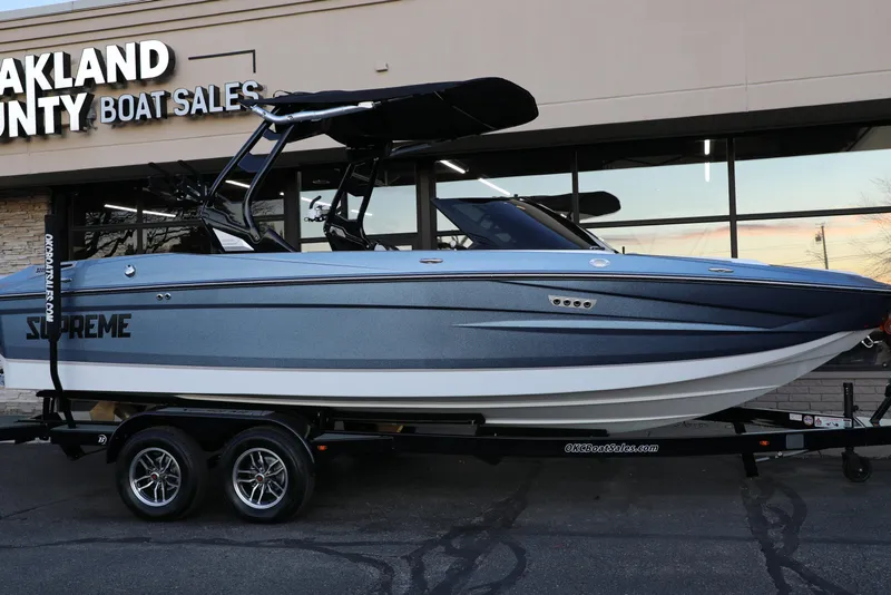 Slide: The Image of 2026 Supreme S220 boat displayed at Oakland County Boat Sales. - 25