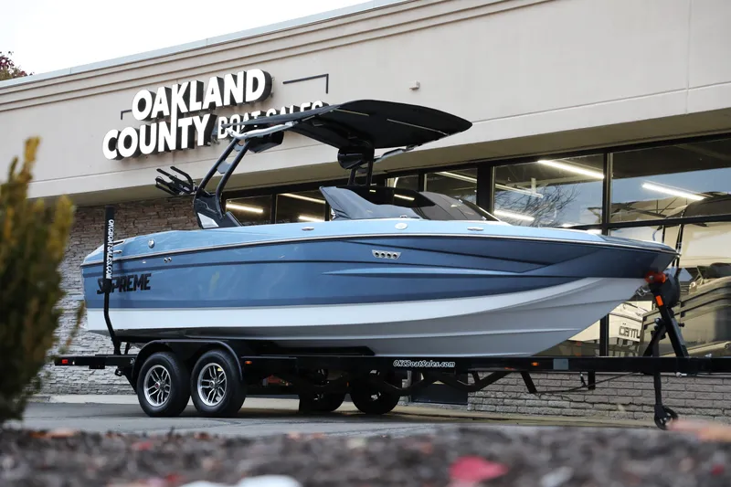 Slide: The Image of 2026 Supreme S220 boat on trailer outside Oakland County Boat Sales. - 27